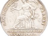 a close up of a silver coin with a woman on it