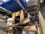 many boxes of assorted items sitting on the floor