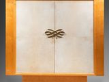 an art deco cabinet with two doors and two drawers