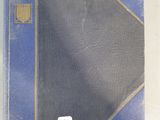 a book with a blue cover sitting on a table