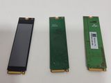 three pieces of electronic components are shown on a white surface