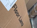 a cardboard box with a sticker that says floor lamp on it