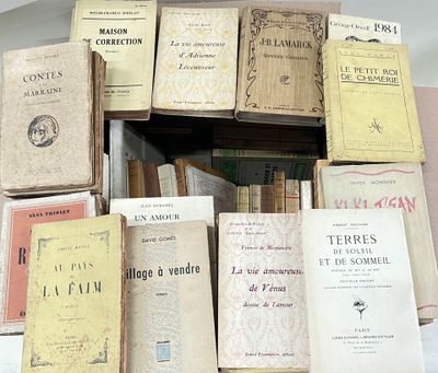 a lot of books that are stacked on top of each other