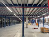 a large warehouse with a lot of steel beams