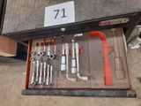 a tool box with tools in it sitting on the floor