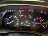 a close up of a car dashboard with various gauges