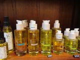many bottles of different types of skin care products on a shelf
