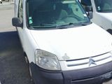 a white van that is parked in a parking lot