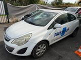 a small white car parked in a parking lot