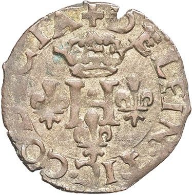 a silver coin with a crown on top of it
