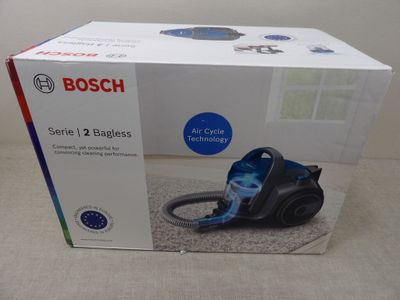 the box of the vacuum cleaner is open on the table