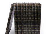 a stack of old books sitting on top of each other
