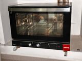 a small oven that is sitting on a counter