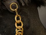 an image of a horse with a gold chain around its neck