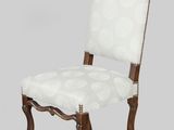 a wooden chair with a white upholstered seat and a white upholstered back
