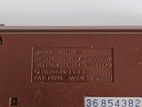 a close up of the back of a brown laptop