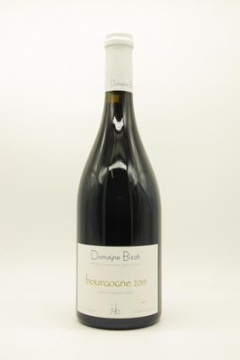 a bottle of wine that is sitting on a table