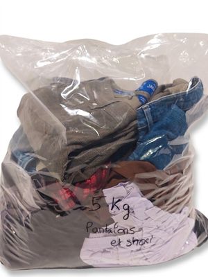 a bag full of clothes that is sitting on a table