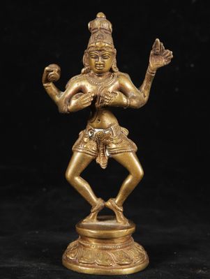 a bronze statue of a woman holding an apple