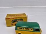 a toy bus that is sitting next to a box
