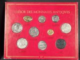 a red book with a bunch of different coins on it