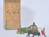 figurine of a man on a horse pulling a bull with a carton