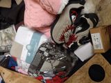 a pile of clothes and other items in a suitcase