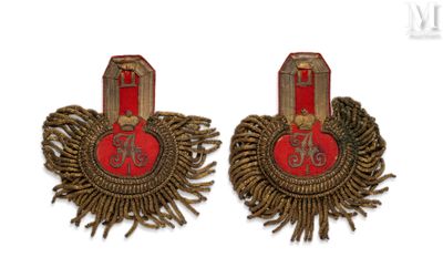 two pairs of red and gold earrings with fringes on them