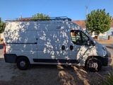 a white van that is parked on the side of the road