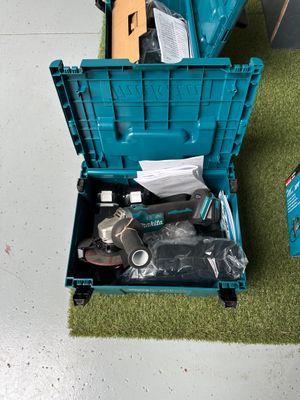 a blue tool box with tools in it on the floor