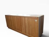 an image of a wooden cabinet with a white counter top