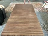 a large wooden table in the middle of a living room