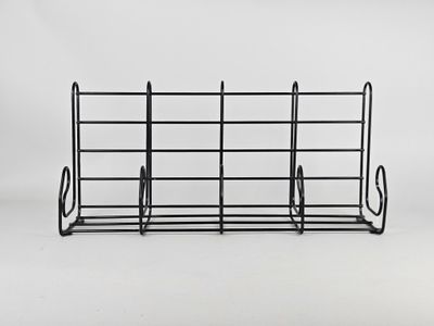a black wire rack with a bunch of books on it