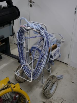 an image of a room that has a cart and a fan in it