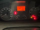 a car dashboard with a speedometer and a clock on it