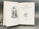 un livre ouvert sur lequel figure le dessin d'un homme et d'un chien