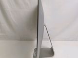 a laptop computer sitting on a stand on a white surface