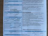 an image of a close up of a document with a barcode on it