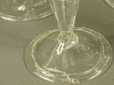 three empty wine glasses sitting on a table