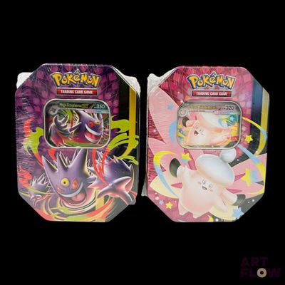 two tins of pokemon cards are shown on a black background