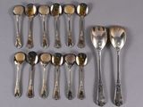 a lot of spoons and spoon spoons on the table
