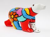 brightly colored ceramic polar bear figurine on a white background