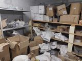 a room full of boxes and other items in it