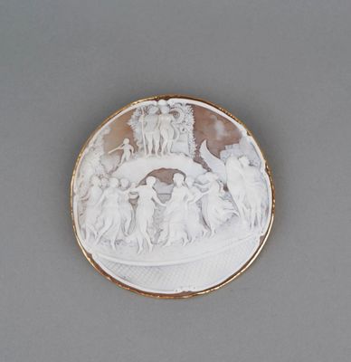 a white and gold plate with a picture of a group of people on it