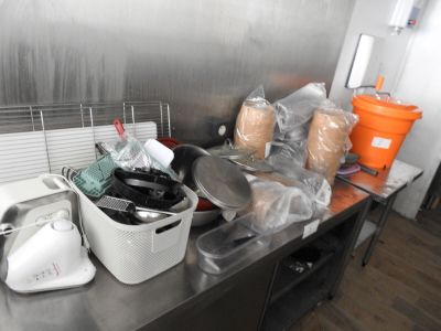a kitchen counter with a lot of food on it