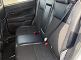 the back seats of a car are black in color