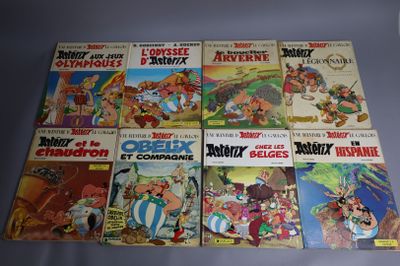 several comics are lined up in a row on a table