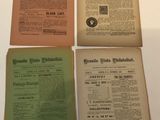 four old newspapers are sitting on a white table
