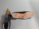 a pair of shoes sitting on a table next to each other
