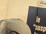 a poster of a man with a mustache on a wall